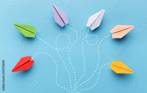 Paper planes with route trace on blue background