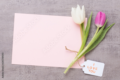 Fototapeta Naklejka Na Ścianę i Meble -  Spring greeting card, pink color tulips on the gray background.