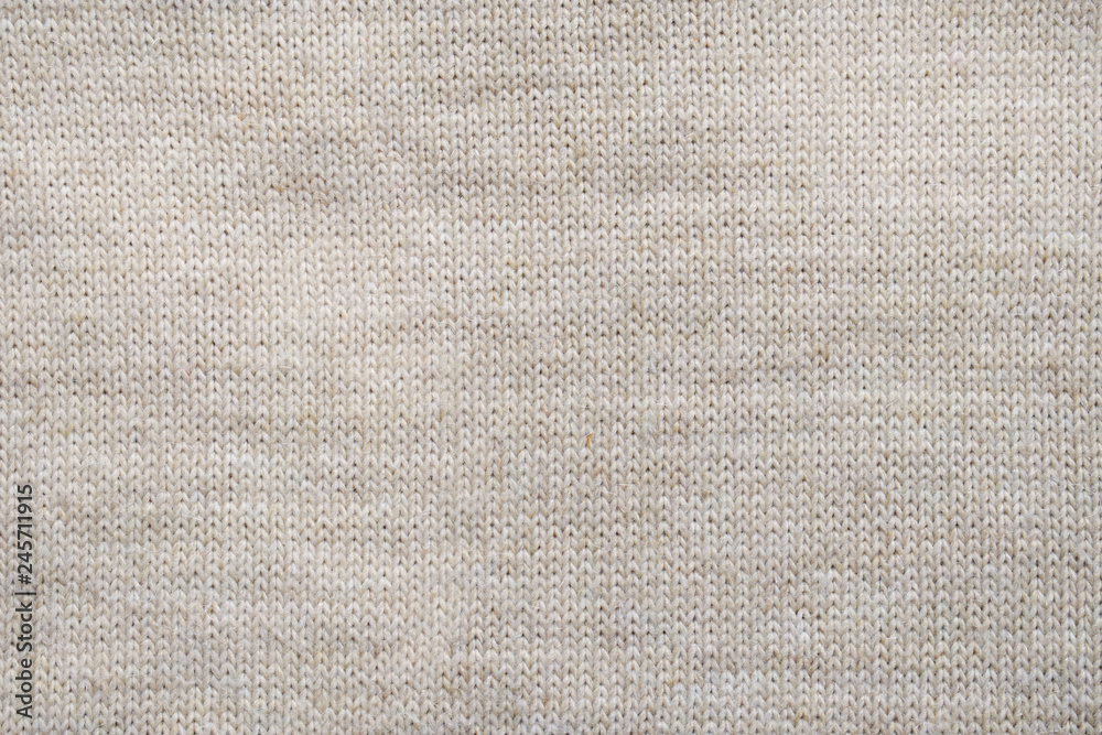 Fototapeta premium Grey knitted background. Surface wool texture. Copy space for your text
