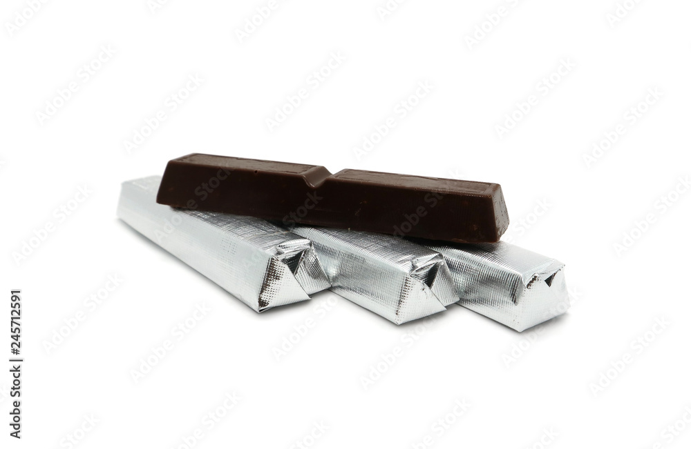 Chocolate candy unfolded and candy wrapped isolated on white background. Chocolate candy unfolded and candy wrapped isolated on white background.