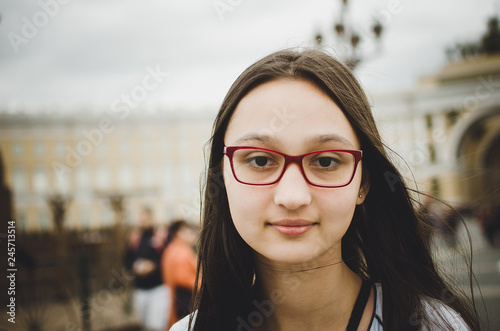 Portrait of a beautiful brunette girl with glasses. Toned photo, instaram style.