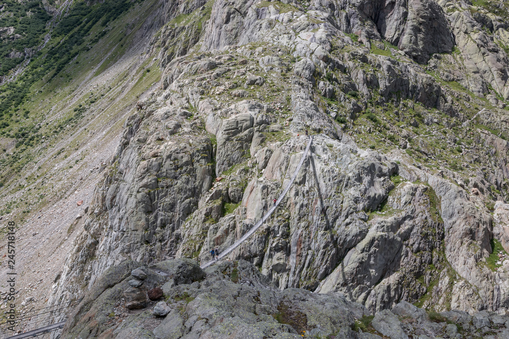 Closeup mountains scenes, walk to Trift Bridge in national park Switzerland