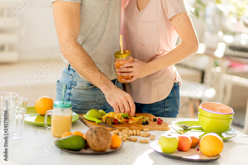 young couple with smoothie. close up cropped photo. beverage for health. treatmnet concept