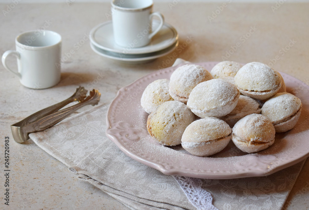 Walnut shaped cookies with cream. Shortbread with caramel and walnuts stuffing. Russian or ukrainian sweets oreshki. Copy Space. Walnut shaped cookies with cream. Shortbread with caramel and walnuts stuffing. Russian or ukrainian sweets oreshki. Copy Space.