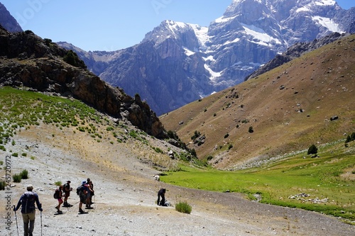 Group of people hiking in the mountains, Fann Mountains, Tajikistan 
