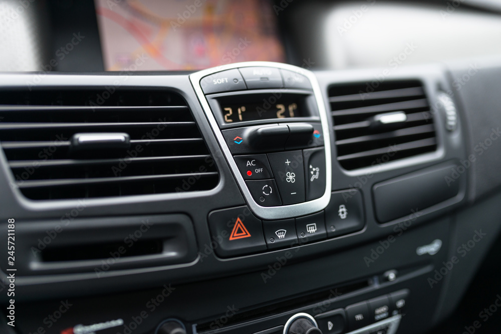 Car dashboard interior of modern car. Black cockpit with button and icon  for air conditioner option, car window heating buttons and emergency lights  button. Stock-Foto | Adobe Stock
