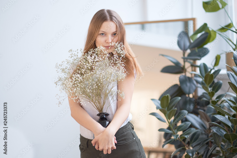 young girl with natural make-up, posing with flowers at home, beautiful clean skin. young girl with natural make-up, posing with flowers at home, beautiful clean skin.