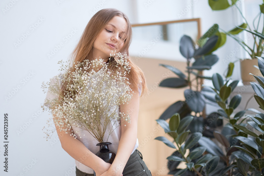 young girl with natural make-up, posing with flowers at home, beautiful clean skin. young girl with natural make-up, posing with flowers at home, beautiful clean skin.