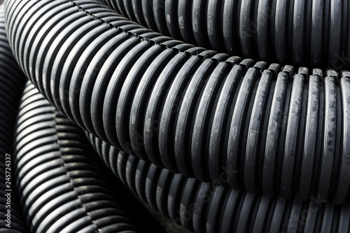 Coiled industrial tubes placed together.