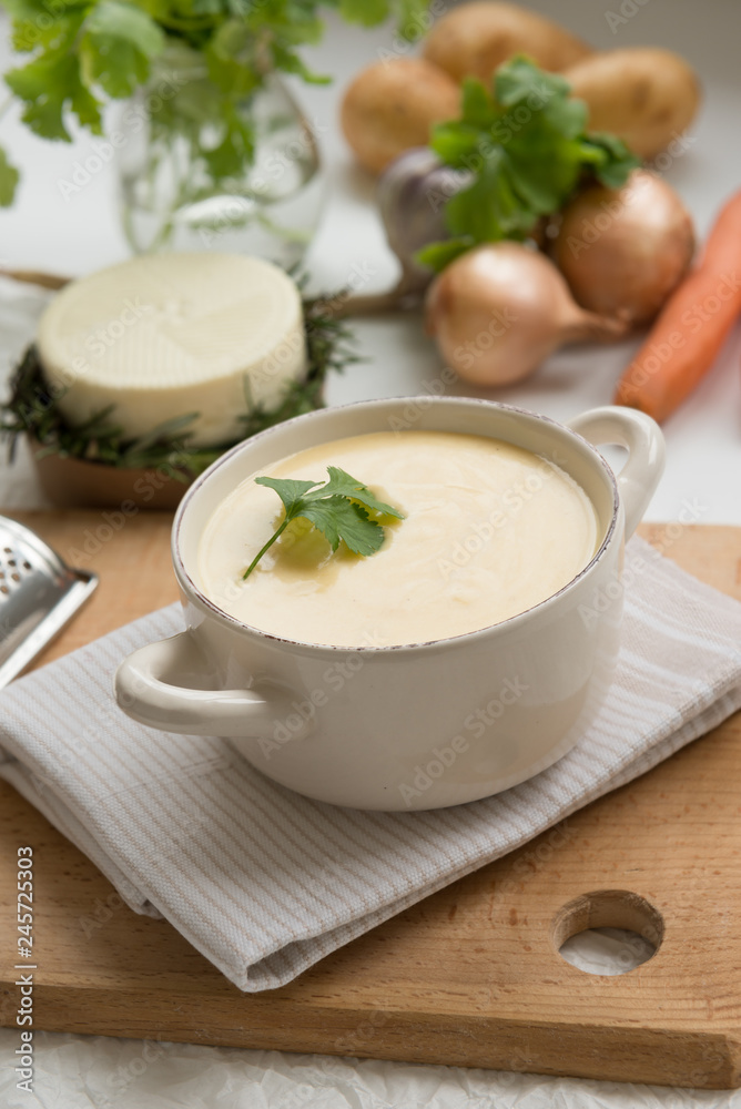 Cheese soup with yellow and white cheese, cream, onions and potatoes. Healthy Vegetarian Food Cheese soup with yellow and white cheese, cream, onions and potatoes. Healthy Vegetarian Food
