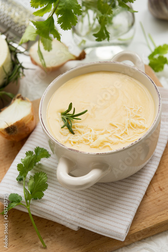 Cheese soup with yellow and white cheese, cream, onions and potatoes