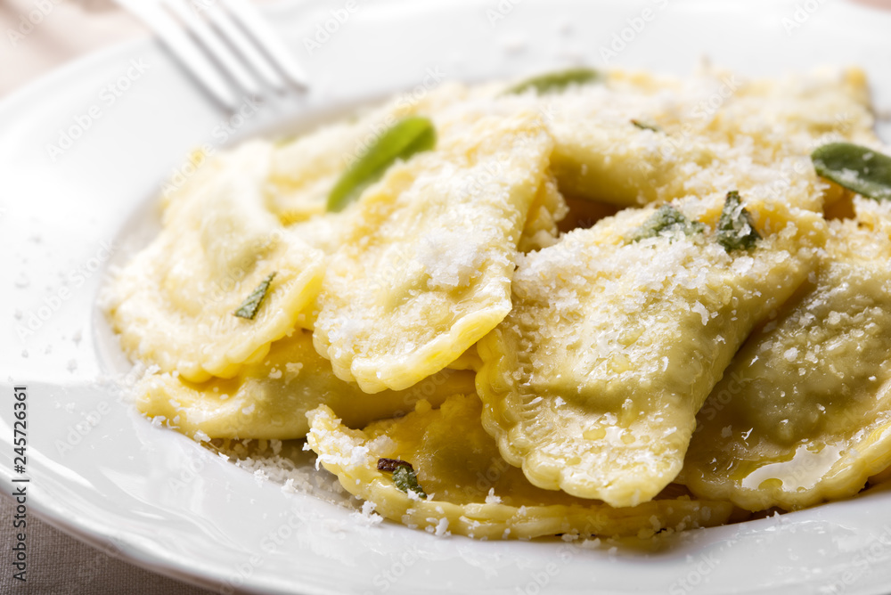Ricotta and spinach ravioli with parmesan, sage and butter sauce.