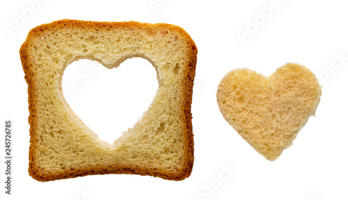 Toast bread slice with a heart shape carved, isolated on white
