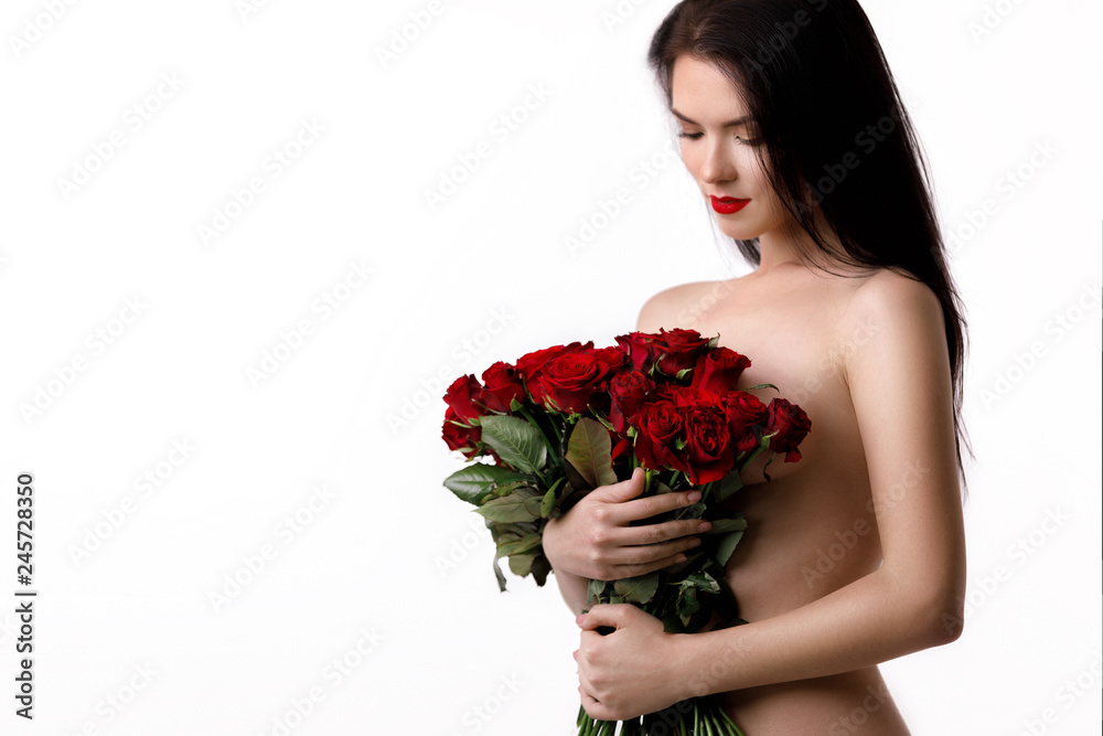 beautiful young woman with a large bouquet of red roses beautiful young woman with a large bouquet of red roses