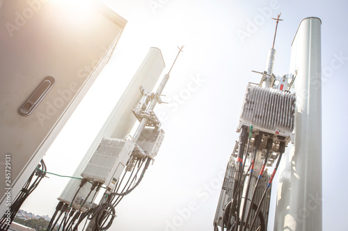 Fototapeta Naklejka Na Ścianę i Meble -  5G smart mobile telephone radio network antenna base station. Transmitter connection system at cellular phone antennas.