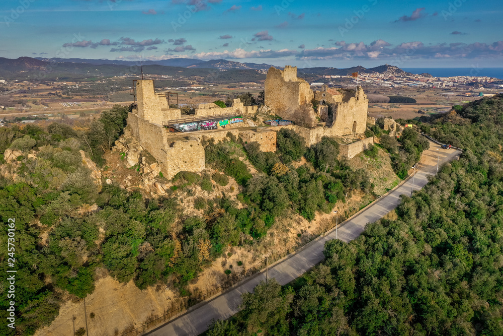 Aerial view of Palafolls castle medieval ruined stronghold between Girona and Barcelona on the Costa Brava an example how graffiti can ruin a cultural heritage site