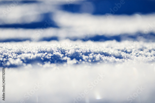 Winter mini macro of snow, white snow with blue shadow effect, beautiful view landscape. North of Russia during winter snowy time. Nature beauty in picturesque scenery as cover background © yanamavlyutova