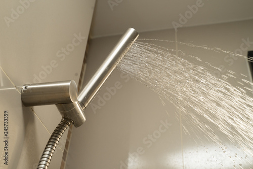 Shower Head and Shower Hose stainless steel push smooth water flow near window sunlight