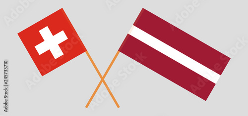 Switzerland and Latvia. The Swiss and Latvian flags. Official colors. Correct proportion. Vector photo