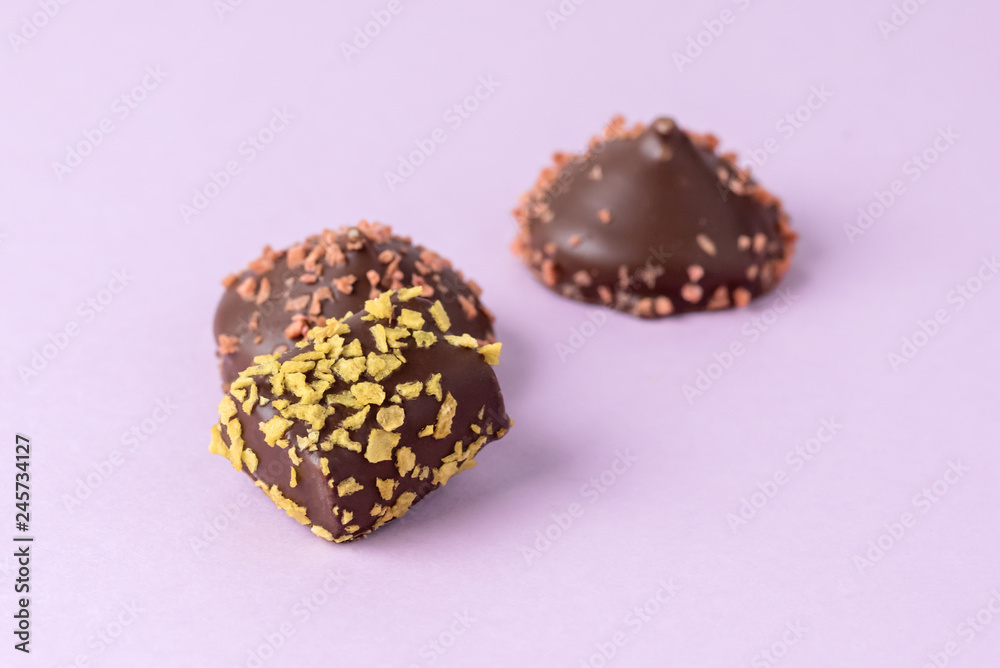 Three Tasty Chocolate Candies on Pink Background Horizontal Copy Space Beautiful Candies Three Tasty Chocolate Candies on Pink Background Horizontal Copy Space Beautiful Candies