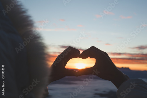 Heart in hands, loving couple and sunrise background, Couple in love, Happy couple in love, Love couple.