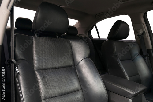 Black leather seats in modern car. Interior detail.