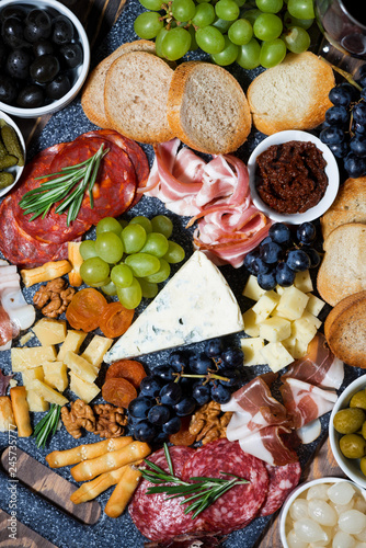 assorted gourmet cheeses and meats  vertical top view