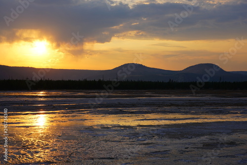 Sunset fumes over the Grand Prismatic pool in Yellowstone National Park, United States