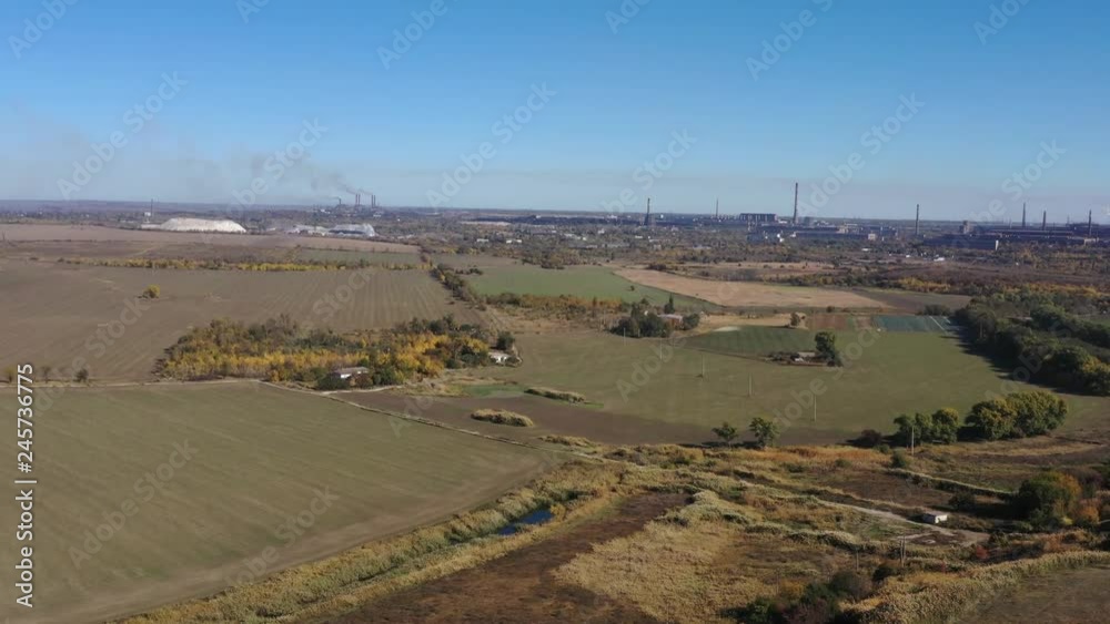 Aerial view. Farm in the midst of autumn fields Aerial view. Farm in the midst of autumn fields