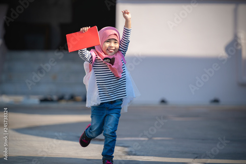 Asian Muslim child girl is happy for going to school. education concept.