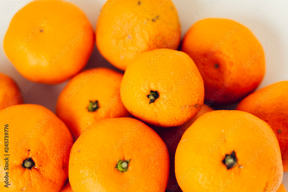 Fresh whole mandarin oranges background , top view. Fresh whole mandarin oranges background , top view.