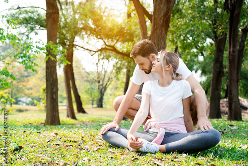 Caucasian Couples are sitting and relaxing, exercising in the garden in the morning of summer with good weather. Suitable for doing various activities That builds family love relationships