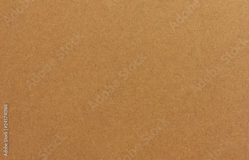 Brown drawing board texture background. Compressed particle board texture close up.