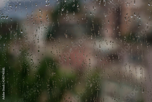 background rain drops on a window pane © berna_namoglu