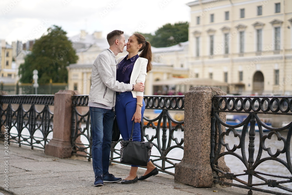 charming good couple husband and wife walking around the city, hugging and spending time with love charming good couple husband and wife walking around the city, hugging and spending time with love