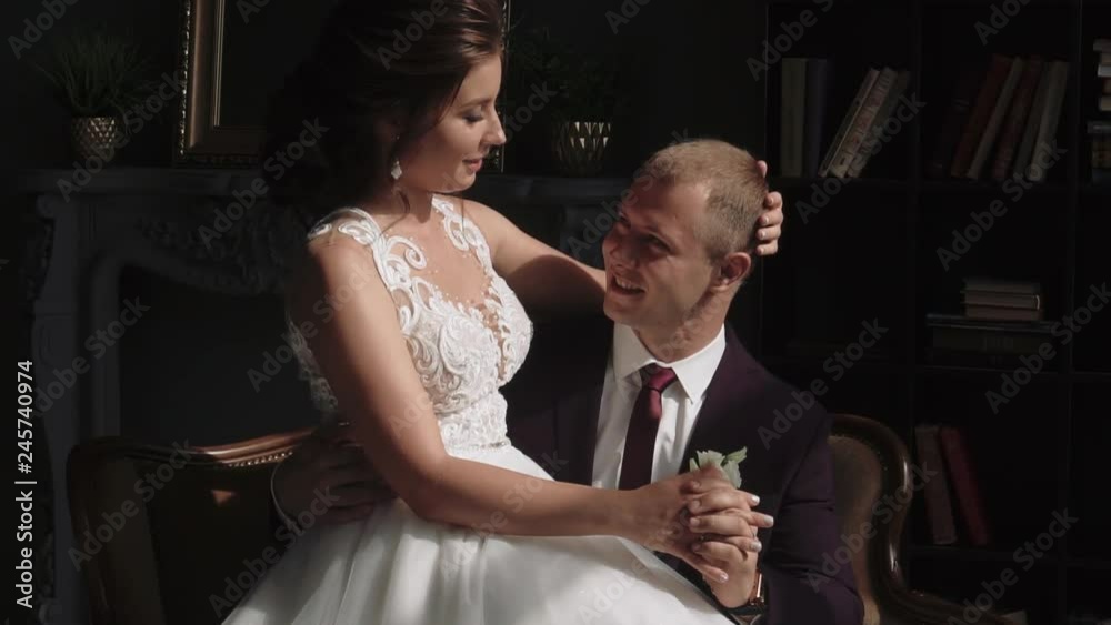 young couple in love man and woman in a wedding dress in the interior young couple in love man and woman in a wedding dress in the interior