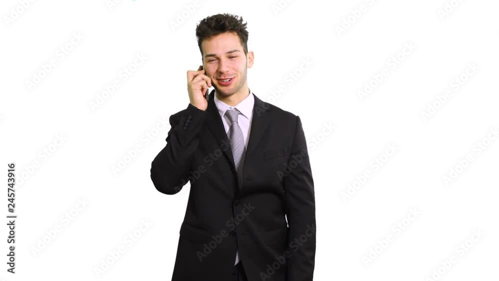 Smiling businessman talking at the phone isolated on white Smiling businessman talking at the phone isolated on white