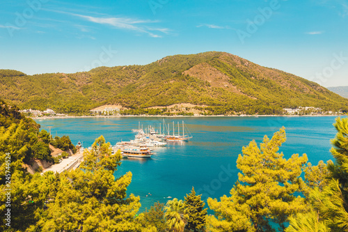 Panoramic beautiful view berth of marina. In the Turkish city of Icmeler. View of the island in the bay