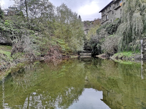 A small river crossing an old town