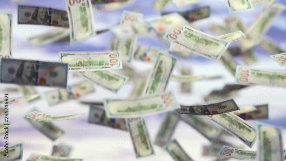 Raining money from the sky, American dollar bills falling everywhere. Concept of wealth, making easy money, without difficulty. 