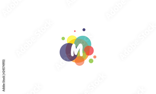 Bright and colorful image of the letter M, against the background of multicolored circles.