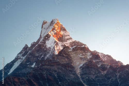 Fish Tail (Machapuchare) - one of the most beautiful and recognizable peaks of the Himalayas. Top in the rays of the rising sun