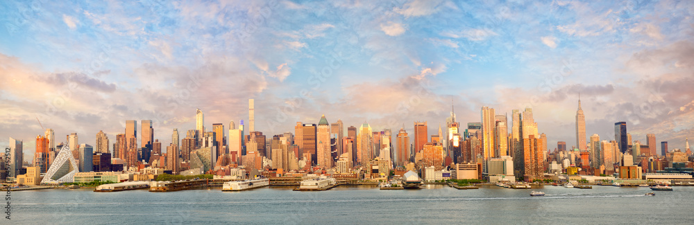 New York City Manhattan skyline panorama at sunset over Hudson River