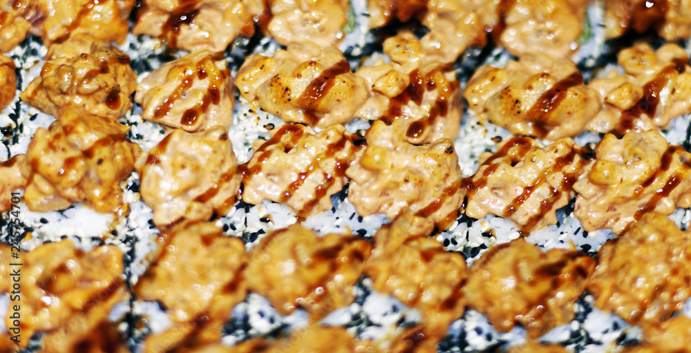 Panorama banner of traditional Japanese dishes with uramaki sushi, gomoku yakisoba, tempura shrimp and fried noodles with shellfish and squid Panorama banner of traditional Japanese dishes with uramaki sushi, gomoku yakisoba, tempura shrimp and fried noodles with shellfish and squid