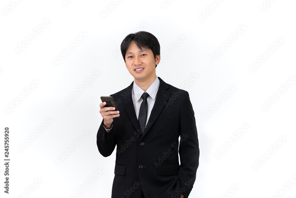 Handsome Asian businessman using mobile phone on white background Handsome Asian businessman using mobile phone on white background