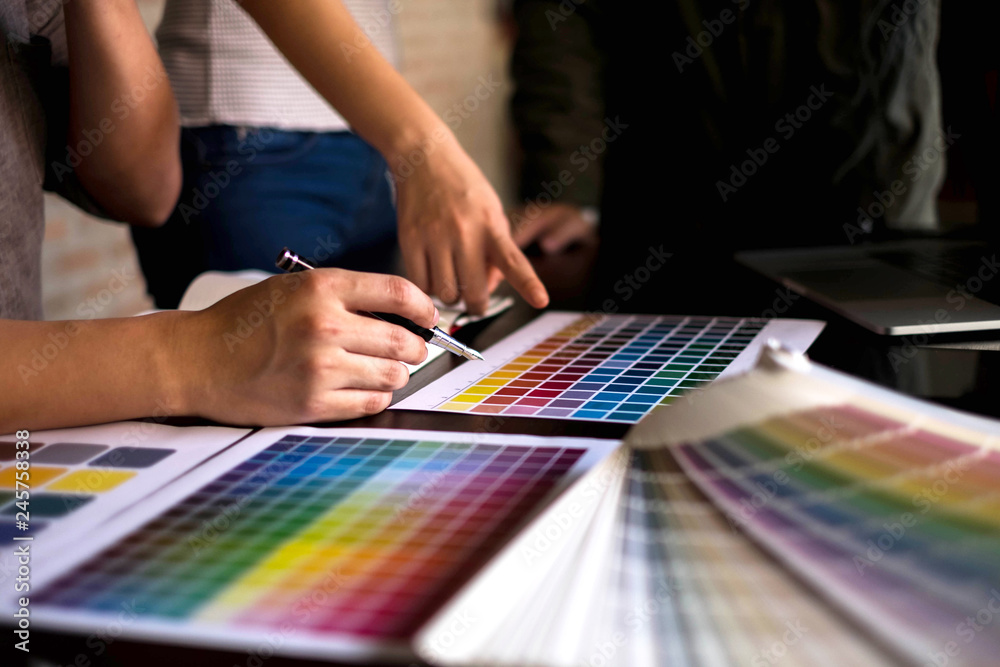 Graphic designers choose colors from the color bands samples for design .Designer graphic creativity work concept .