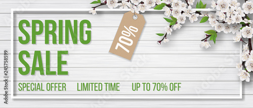 Spring sale. Blooming tree branch, frame and typographic on white wooden background. Background for invitation, discount offer or flyer. Realistic detailed vector template.