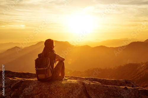 Hiker meets the sunset on the Moro rock in Sequoia national park, California, USA. photo