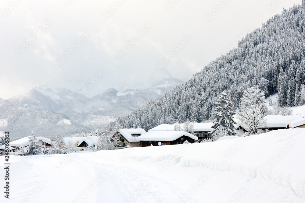 The winter ski chalet and cabin in snow mountain landscape in Austria, Europe.