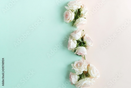 Flowers composition background . beautiful pale pink roses on pale pink mint  background.Top view.Copy space © irenastar